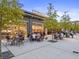 Exterior view of Halcyon featuring people dining at outside seating area at 5315 Bentley Hall Dr, Alpharetta, GA 30005