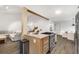 Bright, open kitchen featuring a gas range stove, stainless steel appliances, and seamless access to the living space at 5315 Bentley Hall Dr, Alpharetta, GA 30005
