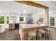 Bright, modern kitchen features an island with seating and stainless steel appliances at 5315 Bentley Hall Dr, Alpharetta, GA 30005