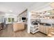 Open kitchen with a center island and pantry, seamlessly connected to the dining and living areas at 5315 Bentley Hall Dr, Alpharetta, GA 30005
