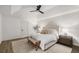 Serene main bedroom featuring vaulted ceilings, a ceiling fan, and hardwood floors with a neutral color palette at 5315 Bentley Hall Dr, Alpharetta, GA 30005