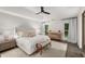Serene main bedroom featuring a tray ceiling, neutral tones, and lots of natural light at 5315 Bentley Hall Dr, Alpharetta, GA 30005
