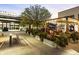 Charming outdoor patio area with string lights and garden beds, ideal for relaxing evenings at 5315 Bentley Hall Dr, Alpharetta, GA 30005