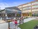 Gathering-friendly outdoor space with patio seating and bubble machines near Cherry Street Brewpub at 5315 Bentley Hall Dr, Alpharetta, GA 30005