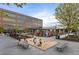 Gathering-friendly playground with sand box, grassy area, and exterior of building at 5315 Bentley Hall Dr, Alpharetta, GA 30005