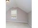 Attic bedroom featuring a window and neutral decor at 1015 Buckeye Ln, Villa Rica, GA 30180