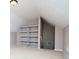 Finished attic space with shelving, neutral carpet, and slanted ceilings offering a versatile area for storage or recreation at 1015 Buckeye Ln, Villa Rica, GA 30180