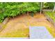 Aerial view of a large backyard with a playset, fenced perimeter, and a well-maintained lawn, perfect for outdoor activities at 1015 Buckeye Ln, Villa Rica, GA 30180