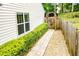 An inviting walkway and decorative fence line the landscaped grounds at 1015 Buckeye Ln, Villa Rica, GA 30180