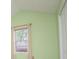 Bright bedroom with light green walls and a large window with curtains at 1015 Buckeye Ln, Villa Rica, GA 30180