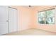 Bedroom featuring closet and window with views of the neighborhood at 1015 Buckeye Ln, Villa Rica, GA 30180
