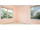 Bedroom featuring two windows offering neighborhood views at 1015 Buckeye Ln, Villa Rica, GA 30180