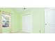 Bright bedroom with a large window and a closet with folding doors at 1015 Buckeye Ln, Villa Rica, GA 30180