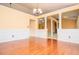Open-concept dining room features hardwood floors, decorative columns, and lots of natural light at 1015 Buckeye Ln, Villa Rica, GA 30180