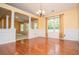 Bright dining room featuring hardwood floors, wainscoting detail, and a modern chandelier at 1015 Buckeye Ln, Villa Rica, GA 30180