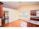 Bright dining room features hardwood floors, natural light, and vaulted ceilings at 1015 Buckeye Ln, Villa Rica, GA 30180