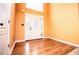 Spacious entryway features wood floors, complemented by a modern glass door and sidelights at 1015 Buckeye Ln, Villa Rica, GA 30180