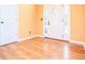Elegant entryway features wood floors, complemented by a modern glass door and sidelights at 1015 Buckeye Ln, Villa Rica, GA 30180