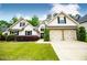 Charming home with a well-manicured lawn, lovely landscaping, and a two-car garage at 1015 Buckeye Ln, Villa Rica, GA 30180