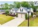 Beautiful home featuring a well-maintained lawn and a spacious two-car garage at 1015 Buckeye Ln, Villa Rica, GA 30180