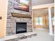 Stone fireplace adds character to the living room, complemented by a decorative mantel and painting at 1015 Buckeye Ln, Villa Rica, GA 30180