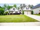 Charming home with a well-manicured lawn, lovely landscaping, and a two-car garage at 1015 Buckeye Ln, Villa Rica, GA 30180