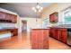 Spacious kitchen with hardwood floors, kitchen island, and stainless steel appliances at 1015 Buckeye Ln, Villa Rica, GA 30180