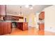 Well-lit kitchen features an island, modern appliances, and rich, dark cabinetry at 1015 Buckeye Ln, Villa Rica, GA 30180