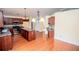 Spacious kitchen with hardwood floors, an island, and stainless steel appliances at 1015 Buckeye Ln, Villa Rica, GA 30180