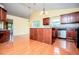 Bright kitchen featuring island, hardwood floors, and stainless steel dishwasher at 1015 Buckeye Ln, Villa Rica, GA 30180
