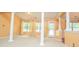 Inviting living room featuring large windows, decorative columns and plenty of natural light at 1015 Buckeye Ln, Villa Rica, GA 30180