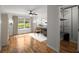 Bedroom featuring hardwood floors, a window with natural light, and a view of an organized closet at 1384 N Crossing Ne Dr, Atlanta, GA 30329
