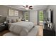 Comfortable bedroom with a ceiling fan, hardwood floors, and large windows for natural light at 1384 N Crossing Ne Dr, Atlanta, GA 30329