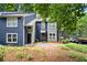 Inviting townhouse with blue siding and manicured landscaping, perfect for a comfortable and stylish living at 1384 N Crossing Ne Dr, Atlanta, GA 30329