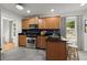 Spacious kitchen featuring stainless steel appliances, wood cabinets, and granite countertops at 1384 N Crossing Ne Dr, Atlanta, GA 30329