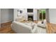 Bright living room featuring a fireplace, hardwood floors, and sliding doors to the outside at 1384 N Crossing Ne Dr, Atlanta, GA 30329