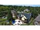 Aerial view showcases the backyard oasis featuring a pool, patio, and lush landscaping at 154 Gold Leaf Trail Trl, Powder Springs, GA 30127