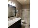 Bathroom featuring vanity with marble countertop, updated shower and neutral color scheme at 154 Gold Leaf Trail Trl, Powder Springs, GA 30127