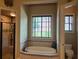 Bathroom with soaking tub, separate shower, and toilet area, offering a relaxing retreat at 154 Gold Leaf Trail Trl, Powder Springs, GA 30127