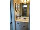 Bathroom with vanity, white cabinets, and decorative lighting at 154 Gold Leaf Trail Trl, Powder Springs, GA 30127