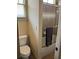 Bathroom with shower and sliding glass door, toilet, and window at 154 Gold Leaf Trail Trl, Powder Springs, GA 30127