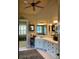 Bright bathroom with marble vanity, dual sinks, and access to a closet and separate toilet area at 154 Gold Leaf Trail Trl, Powder Springs, GA 30127