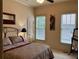 Comfortable bedroom featuring neutral paint, cozy bedding, and natural light at 154 Gold Leaf Trail Trl, Powder Springs, GA 30127