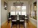 Bright dining area featuring a pendant light fixture and diamond patterned window panes at 154 Gold Leaf Trail Trl, Powder Springs, GA 30127