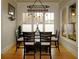 Cozy dining area with table, four chairs, and large window with natural light at 154 Gold Leaf Trail Trl, Powder Springs, GA 30127