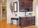 Elegant dry bar featuring granite countertops, custom cabinets, and decorative backsplash at 154 Gold Leaf Trail Trl, Powder Springs, GA 30127