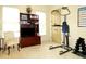 Functional exercise room with a bookshelf, tv, and fitness equipment at 154 Gold Leaf Trail Trl, Powder Springs, GA 30127
