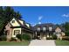 Lovely home featuring stone accents, a well-kept lawn, and an inviting driveway at 154 Gold Leaf Trail Trl, Powder Springs, GA 30127