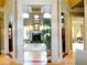 Inviting foyer boasting hardwood floors, columns, fireplace and stylish decor at 154 Gold Leaf Trail Trl, Powder Springs, GA 30127