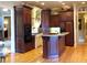 Spacious kitchen features an island, wood cabinets, hardwood floors, and high-end appliances at 154 Gold Leaf Trail Trl, Powder Springs, GA 30127